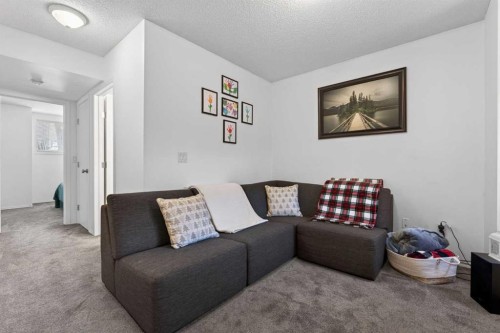 32 Erin Woods Court Se, Calgary, AB - Indoor Photo Showing Living Room