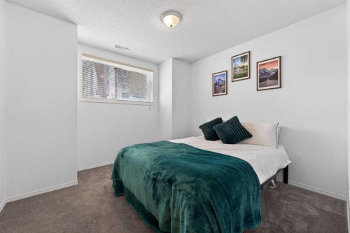 32 Erin Woods Court Se, Calgary, AB - Indoor Photo Showing Bedroom