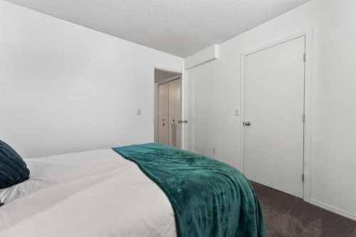32 Erin Woods Court Se, Calgary, AB - Indoor Photo Showing Bedroom