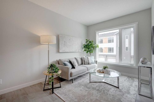 212 Shawnee Square Sw, Calgary, AB - Indoor Photo Showing Living Room