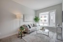 212 Shawnee Square Sw, Calgary, AB  - Indoor Photo Showing Living Room 