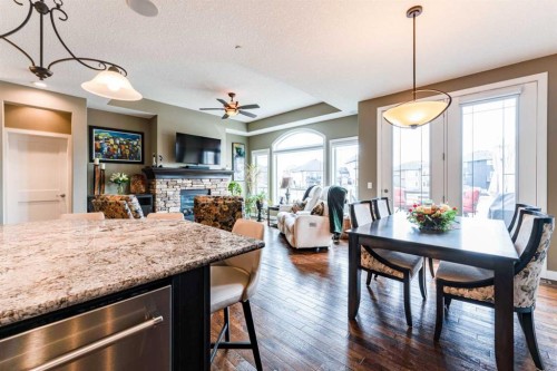 149 Muirfield Boulevard, Lyalta, AB - Indoor Photo Showing Dining Room With Fireplace