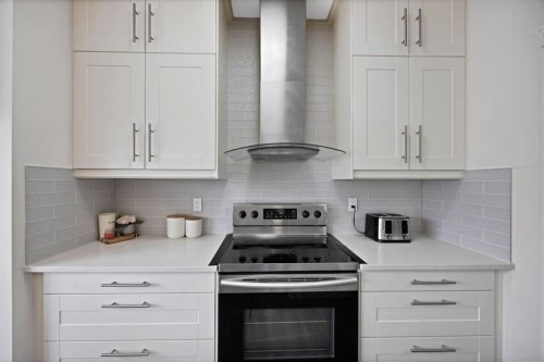 2386 Fairways Circle Nw, Airdrie, AB - Indoor Photo Showing Kitchen With Upgraded Kitchen