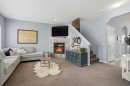 4432 Elgin Avenue Se, Calgary, AB  - Indoor Photo Showing Living Room With Fireplace 