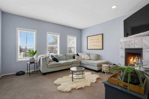 4432 Elgin Avenue Se, Calgary, AB - Indoor Photo Showing Living Room With Fireplace