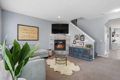 4432 Elgin Avenue Se, Calgary, AB - Indoor Photo Showing Living Room With Fireplace