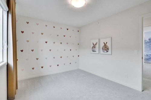 195 Lucas Common Nw, Calgary, AB - Indoor Photo Showing Other Room