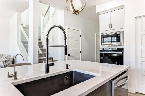 287 Amblehurst Way Nw, Calgary, AB - Indoor Photo Showing Kitchen With Upgraded Kitchen