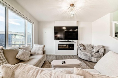 287 Amblehurst Way Nw, Calgary, AB - Indoor Photo Showing Living Room
