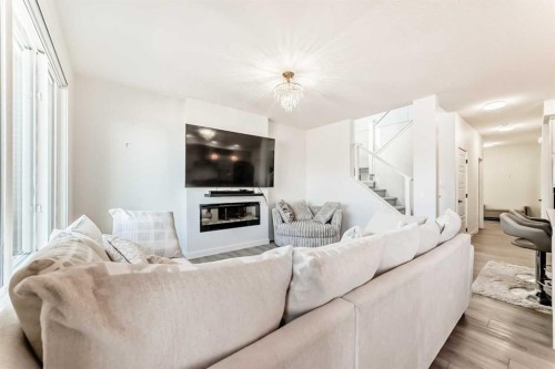 287 Amblehurst Way Nw, Calgary, AB - Indoor Photo Showing Living Room With Fireplace