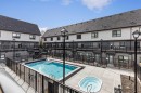 205-105 Kananaskis Way, Canmore, AB  - Outdoor With In Ground Pool 