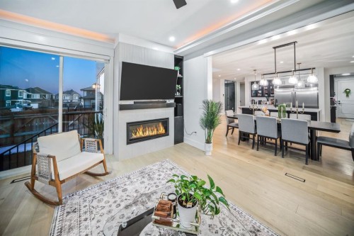 103 Aspen Summit Close Sw, Calgary, AB - Indoor Photo Showing Living Room With Fireplace