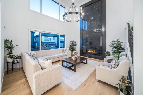 103 Aspen Summit Close Sw, Calgary, AB - Indoor Photo Showing Living Room With Fireplace