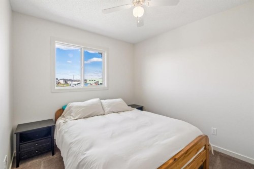 150 River Heights Crescent, Cochrane, AB - Indoor Photo Showing Bedroom