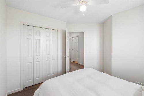 150 River Heights Crescent, Cochrane, AB - Indoor Photo Showing Bedroom