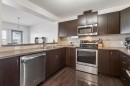 150 River Heights Crescent, Cochrane, AB  - Indoor Photo Showing Kitchen With Double Sink 