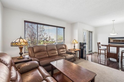 150 River Heights Crescent, Cochrane, AB - Indoor Photo Showing Living Room