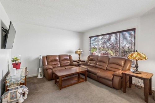 150 River Heights Crescent, Cochrane, AB - Indoor Photo Showing Living Room