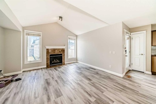 168 Tuscany Springs Way Nw, Calgary, AB - Indoor Photo Showing Living Room With Fireplace