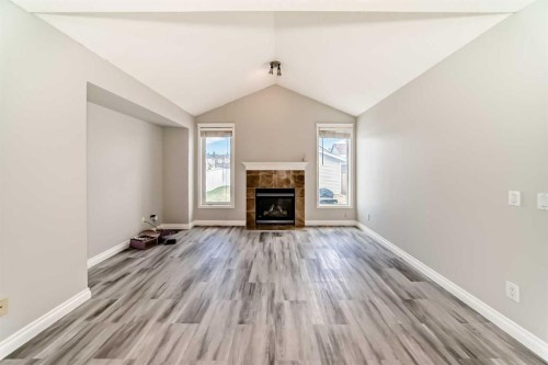 168 Tuscany Springs Way Nw, Calgary, AB - Indoor Photo Showing Living Room With Fireplace