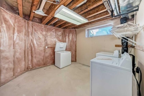 168 Tuscany Springs Way Nw, Calgary, AB - Indoor Photo Showing Laundry Room