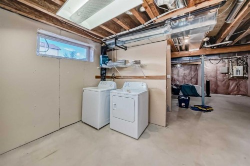 168 Tuscany Springs Way Nw, Calgary, AB - Indoor Photo Showing Laundry Room