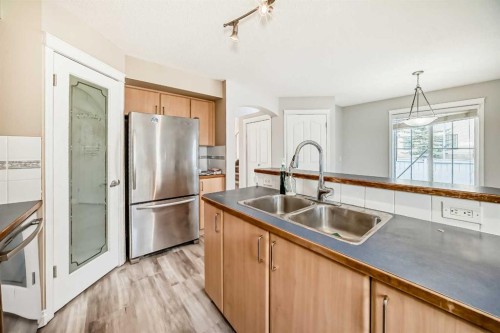 168 Tuscany Springs Way Nw, Calgary, AB - Indoor Photo Showing Kitchen With Double Sink