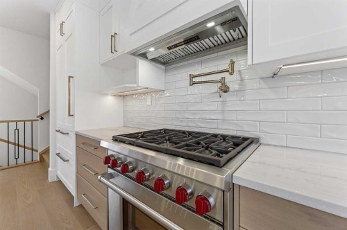 88 Woodlark Drive Sw, Calgary, AB - Indoor Photo Showing Kitchen With Upgraded Kitchen