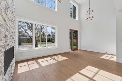 88 Woodlark Drive Sw, Calgary, AB - Indoor Photo Showing Other Room With Fireplace