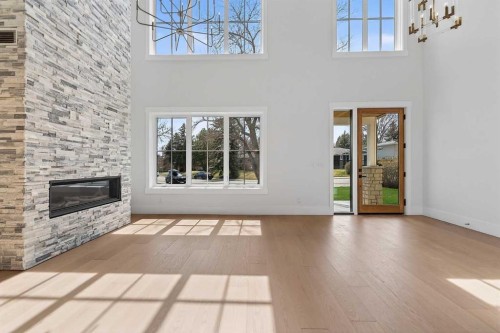 88 Woodlark Drive Sw, Calgary, AB - Indoor With Fireplace