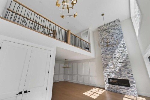 88 Woodlark Drive Sw, Calgary, AB - Indoor Photo Showing Other Room With Fireplace