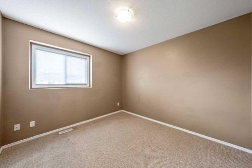 108 Sunrise Terrace Ne, High River, AB - Indoor Photo Showing Other Room