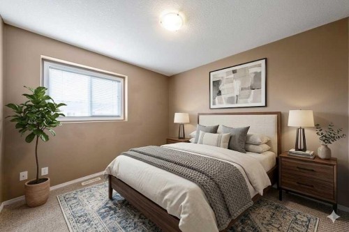 108 Sunrise Terrace Ne, High River, AB - Indoor Photo Showing Bedroom