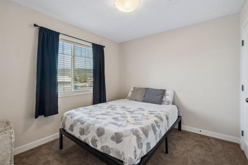 614-413 River Avenue, Cochrane, AB - Indoor Photo Showing Bedroom