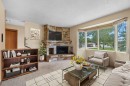 4207 Brisebois Drive Nw, Calgary, AB  - Indoor Photo Showing Living Room With Fireplace 