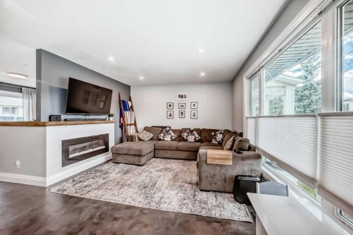 5224 19 Avenue Nw, Calgary, AB - Indoor Photo Showing Living Room With Fireplace