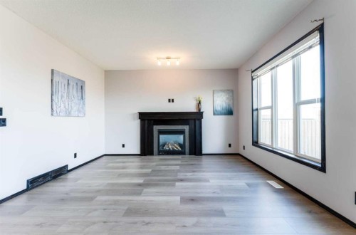 277 Panora Way Nw, Calgary, AB - Indoor Photo Showing Living Room With Fireplace