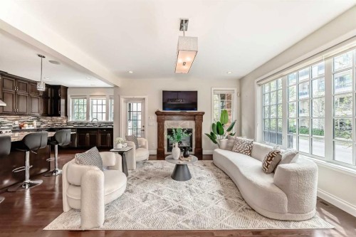 60 Hong Kong Road Sw, Calgary, AB - Indoor Photo Showing Living Room With Fireplace