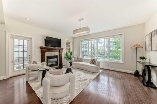 60 Hong Kong Road Sw, Calgary, AB - Indoor Photo Showing Living Room With Fireplace