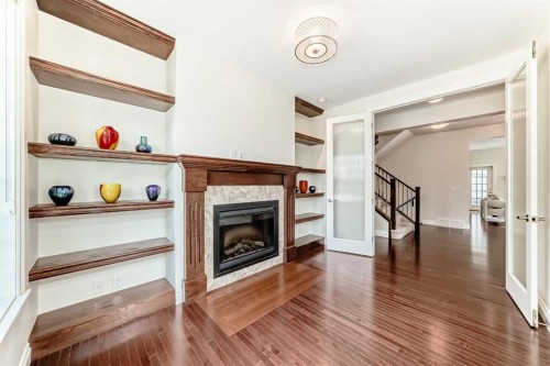 60 Hong Kong Road Sw, Calgary, AB - Indoor Photo Showing Other Room With Fireplace
