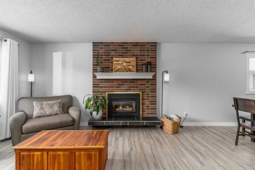 36 Bearberry Crescent Nw, Calgary, AB - Indoor Photo Showing Living Room With Fireplace