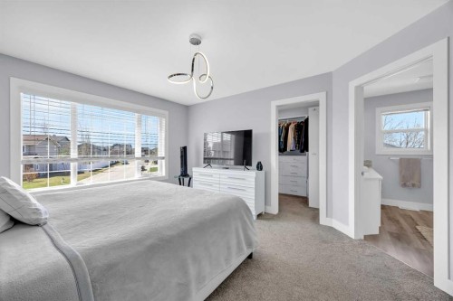 147 Hawkmere View, Chestermere, AB - Indoor Photo Showing Bedroom
