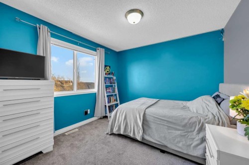 147 Hawkmere View, Chestermere, AB - Indoor Photo Showing Bedroom