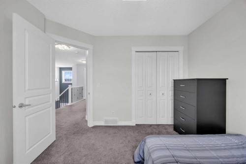 147 Hawkmere View, Chestermere, AB - Indoor Photo Showing Bedroom