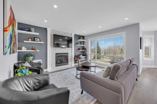 147 Hawkmere View, Chestermere, AB - Indoor Photo Showing Living Room With Fireplace