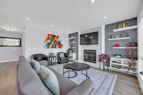 147 Hawkmere View, Chestermere, AB - Indoor Photo Showing Living Room With Fireplace