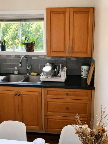 604 69 Avenue Sw, Calgary, AB - Indoor Photo Showing Kitchen With Double Sink