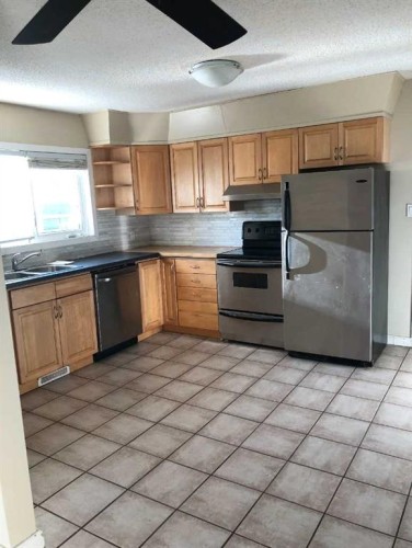 604 69 Avenue Sw, Calgary, AB - Indoor Photo Showing Kitchen With Double Sink