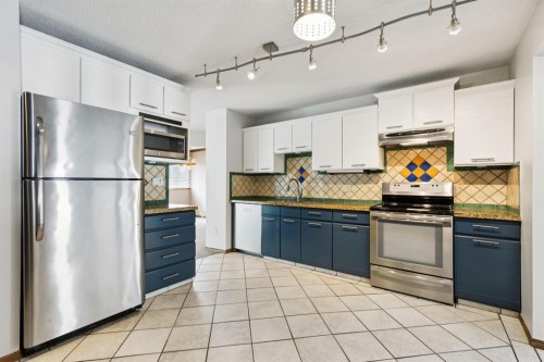 145 Alpine Crescent Se, Airdrie, AB - Indoor Photo Showing Kitchen With Double Sink
