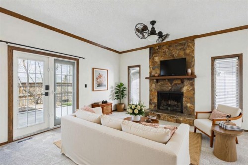 145 Alpine Crescent Se, Airdrie, AB - Indoor Photo Showing Living Room With Fireplace